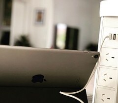 Point Pod Pop Up Power Outlet in White Shown with Laptop Plugged in with USB Cable
